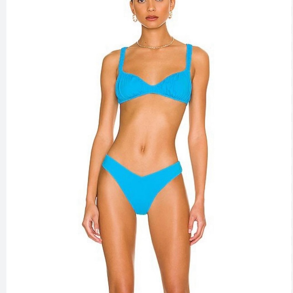 Super flattering blue swimsuit that can fit a small